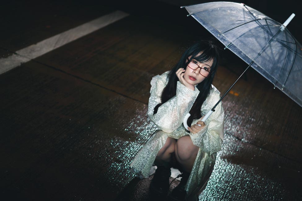 Girl holding an umbrella in the rain
