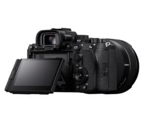 Mirrorless digital camera with a 3-inch tilted LCD screen extended from the back, showing a textured grip and attached lens.