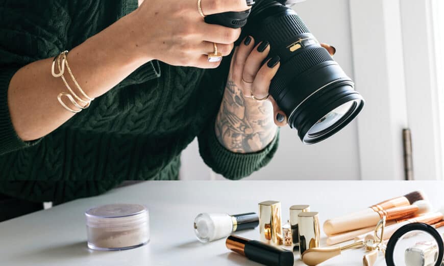 Female photographer taking photos of make-up prouducts