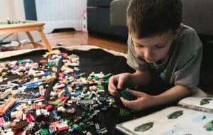 Little boy playing with lego
