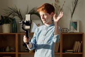 Kid holding phone with gimbal