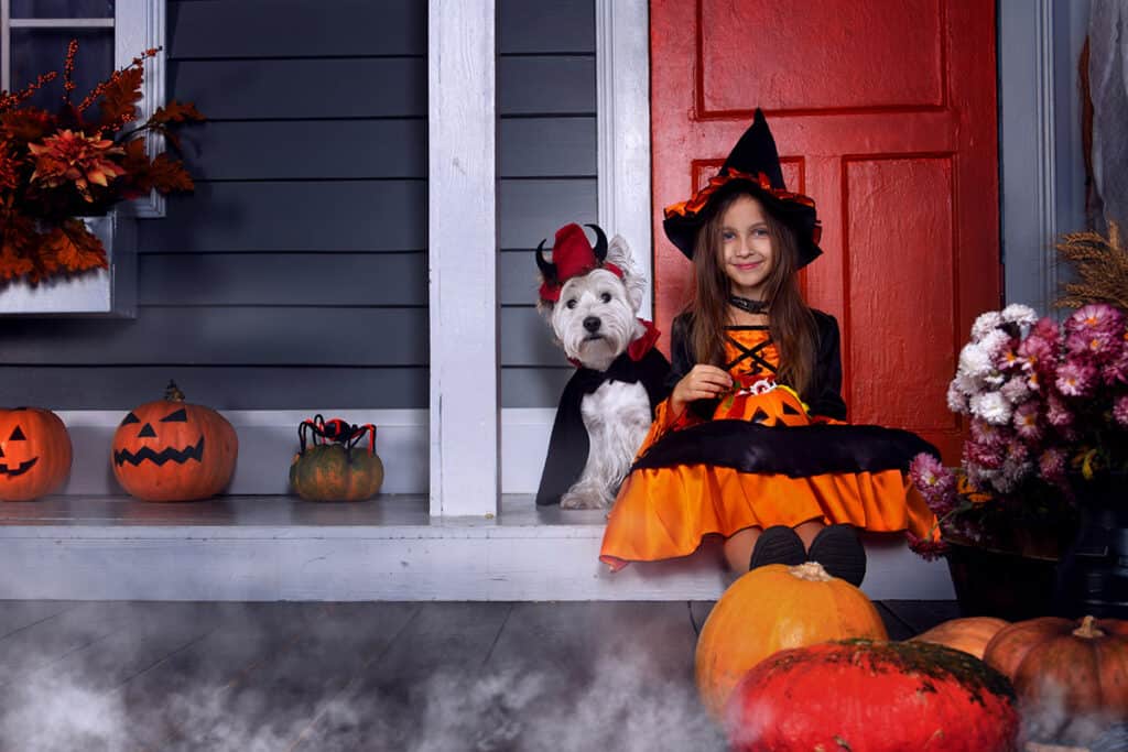 Girl and dog dressed up for halloween