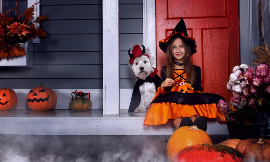 Girl and dog dressed up for halloween