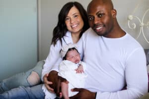 Parents holding baby