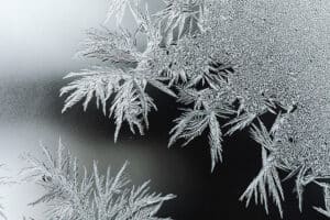 Macro shot of a snowflake on glass