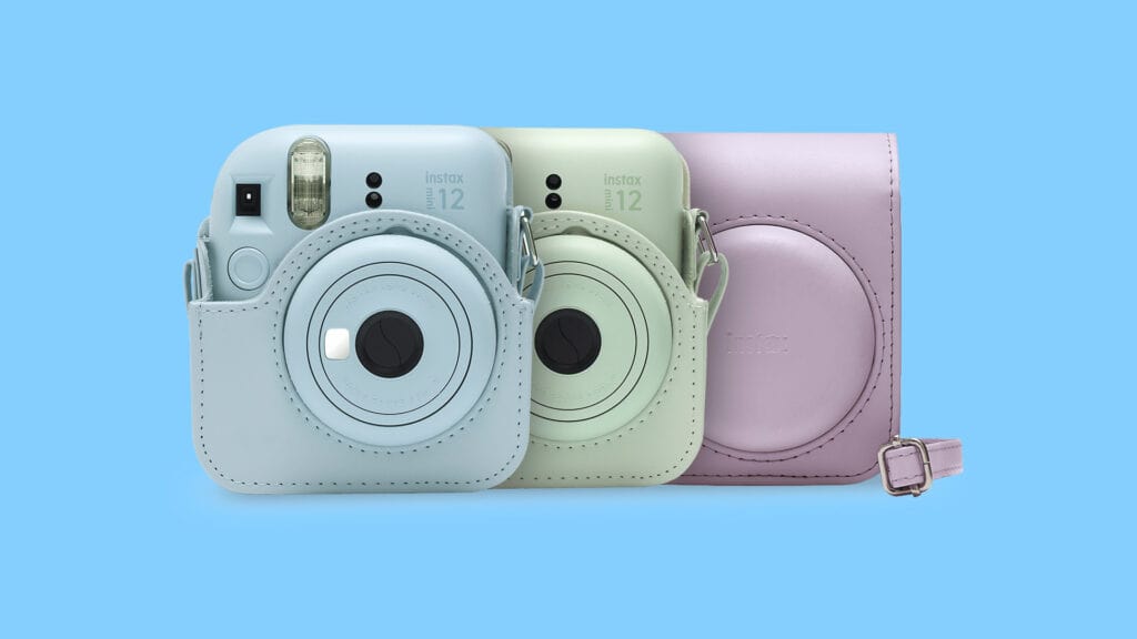 Instax-Case | Photography and video news, reviews and tips | Henry's Camera Three pastel Instax Mini 12 instant cameras in blue, mint green, and pink with matching cases on a blue background, ready for display.