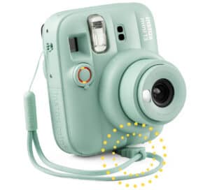 Instax1 | Photography and video news, reviews and tips | Henry's Camera Mint green Instax Mini 9 instant camera with a matching strap hanging from the side and a spiral decorative dotted pattern around the base.