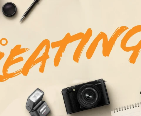 Promotional banner with orange 'BACK TO CREATING' text surrounded by cameras, memory cards, lenses and tripods on a beige background.