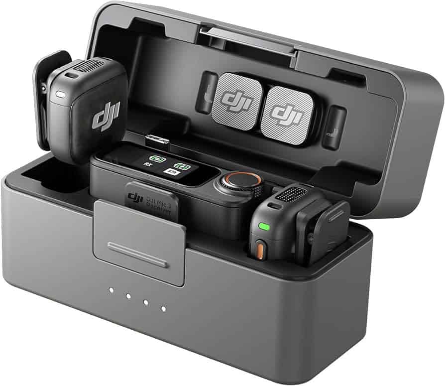 Open gray DJI Mic charging case with a receiver and two wireless transmitters inside.