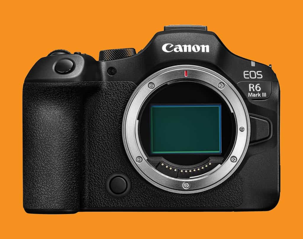 Canon EOS R6 Mark III camera body on an orange background, front view with lens mount exposed