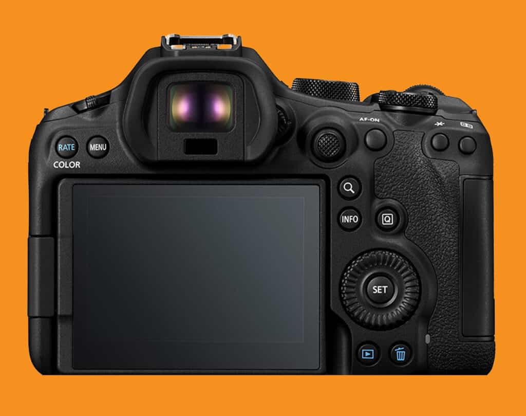Rear view of a black DSLR camera with LCD screen and control dial against an orange background.