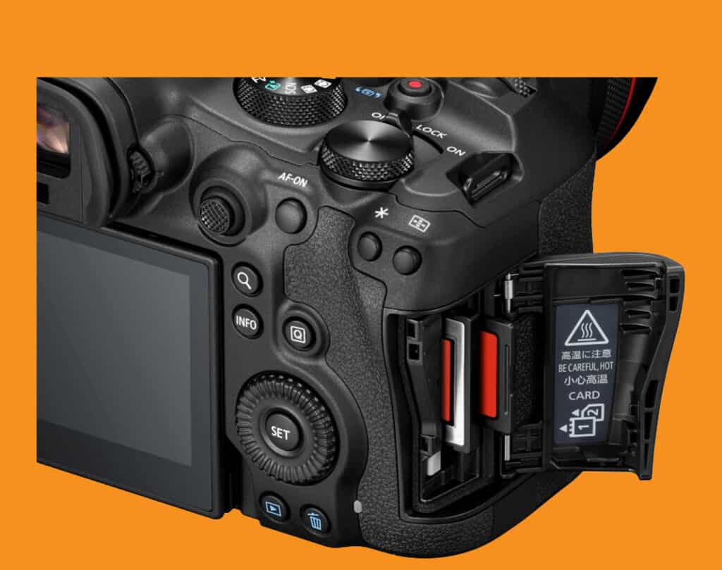 Close-up of a DSLR camera with the battery compartment open on the right side against an orange background.