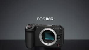 Canon EOS R6v mirrorless camera body with mount exposed on a dark surface, logo above it