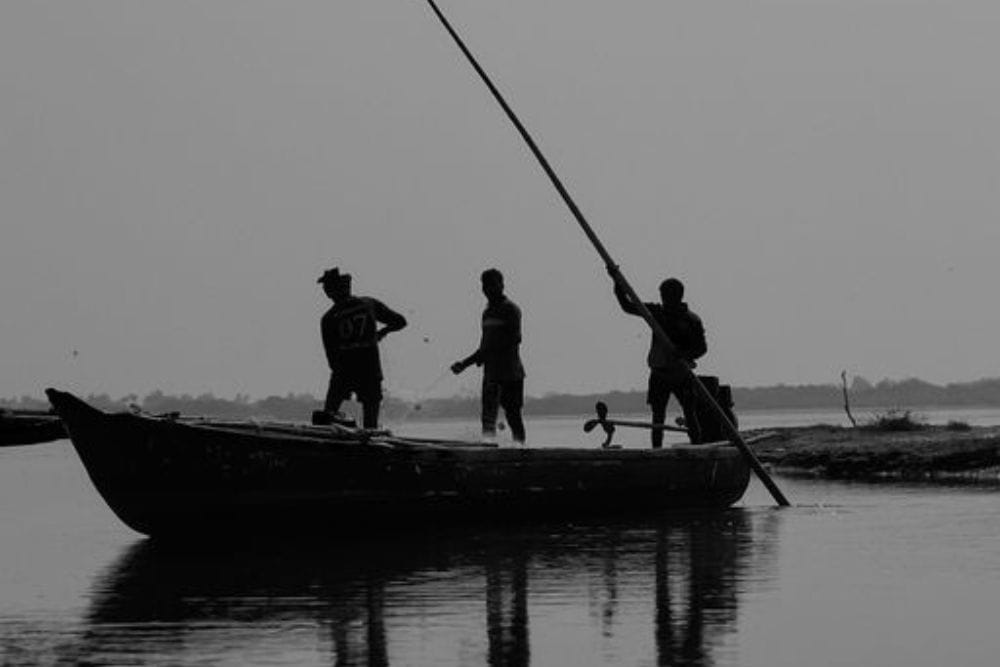 Three People On A Canoe