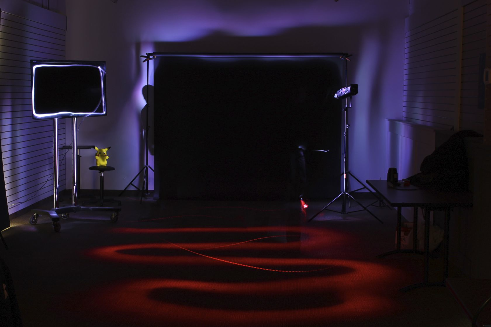 Light painting a room with multiple coloured lights - and the invisible people doing the painting
